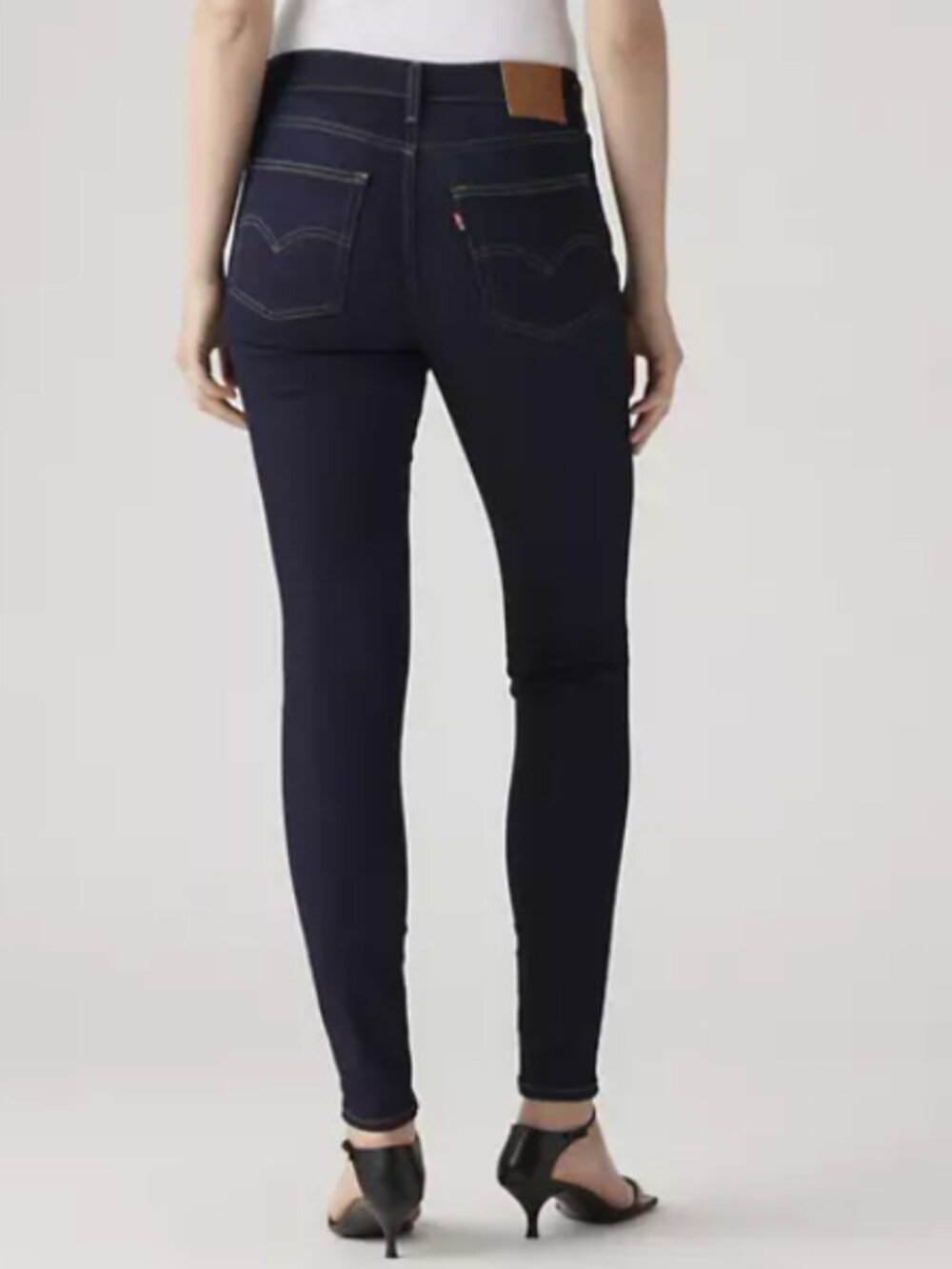 Levi's super high-rise dark wash skinny jeans, size 25